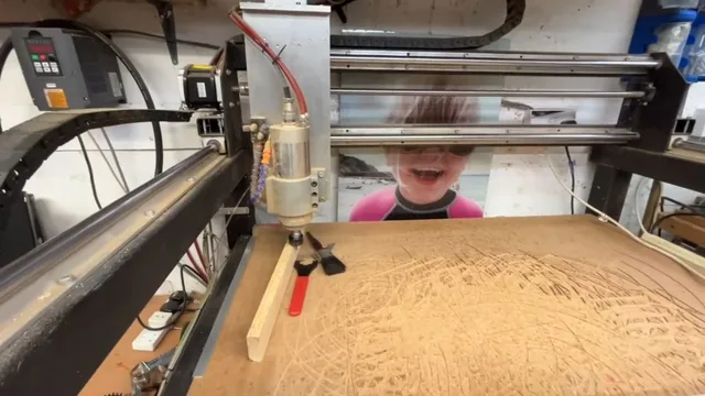 The CNC router spindle and gantry in Chris’s home workshop, captured during the workshop tour